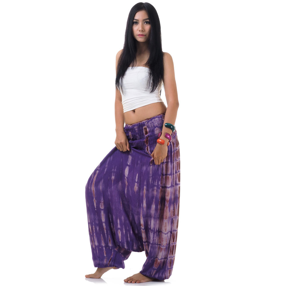 Side view of purple tie dye pants showing the versatile 2-in-1 style.
