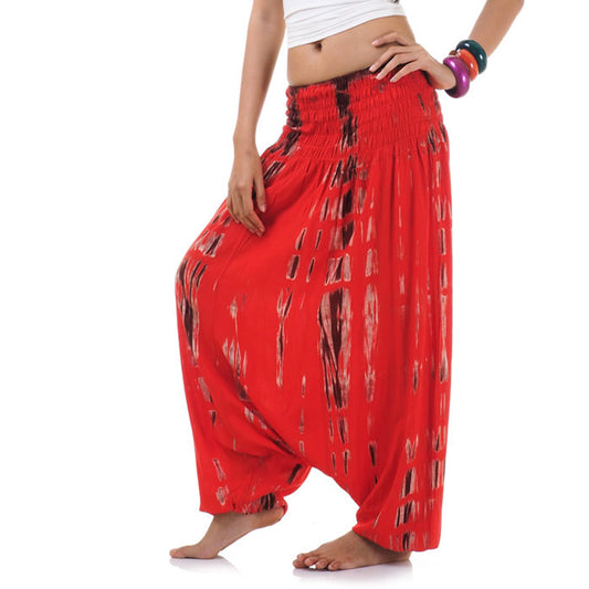 Close-up red tie dye 2-in-1 harem pants, fiery handmade boho style.