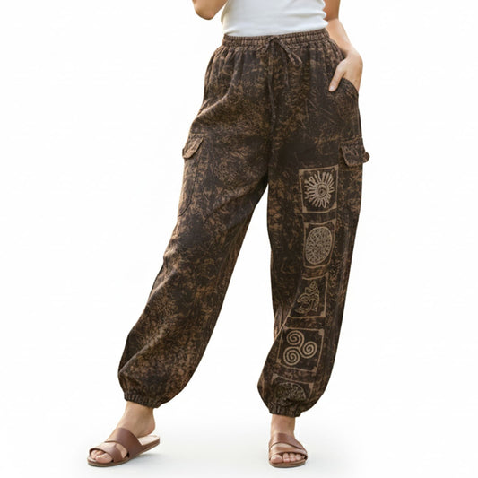 Close-up shot of brown stonewashed tribal mandala harem pants showing natural cotton and cargo pocket detail.