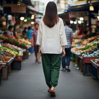 Back view of green boho stonewashed mandala harem pants showing the elastic ankle cuffs.
