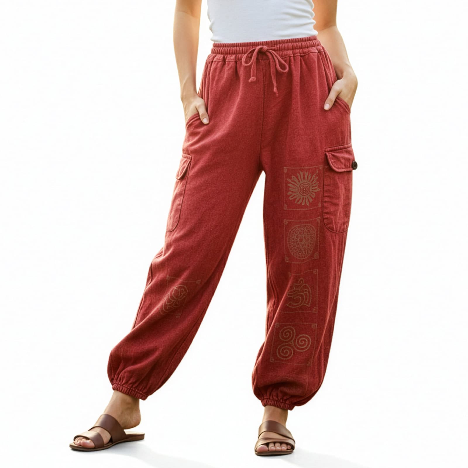 Close-up of red stonewashed tribal mandala harem pants focusing on the vibrant fabric and mandala prints.