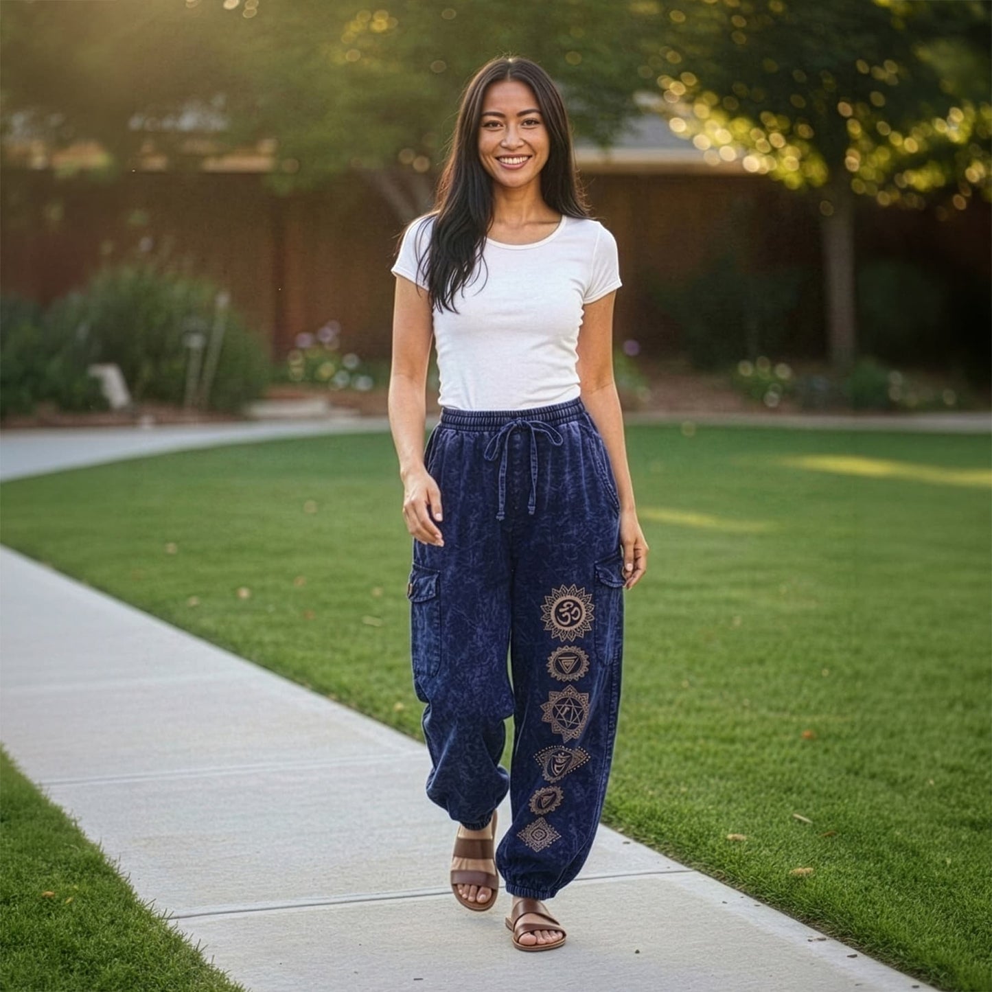 Full front shot of blue boho tribal harem pants with four pockets in an outdoor setting.