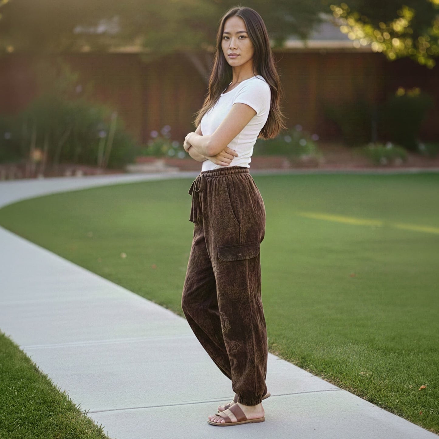 Side view of brown boho stonewashed harem pants showing the bohemian travel style.