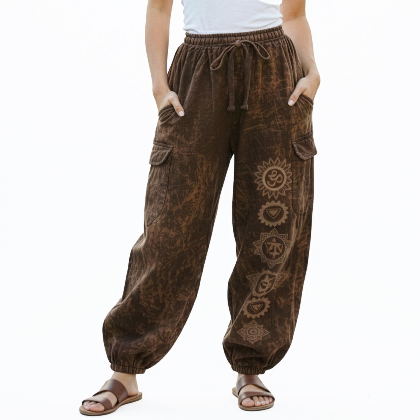 Close-up shot of brown stonewashed tribal om harem pants showing natural cotton and stitched cargo pockets.
