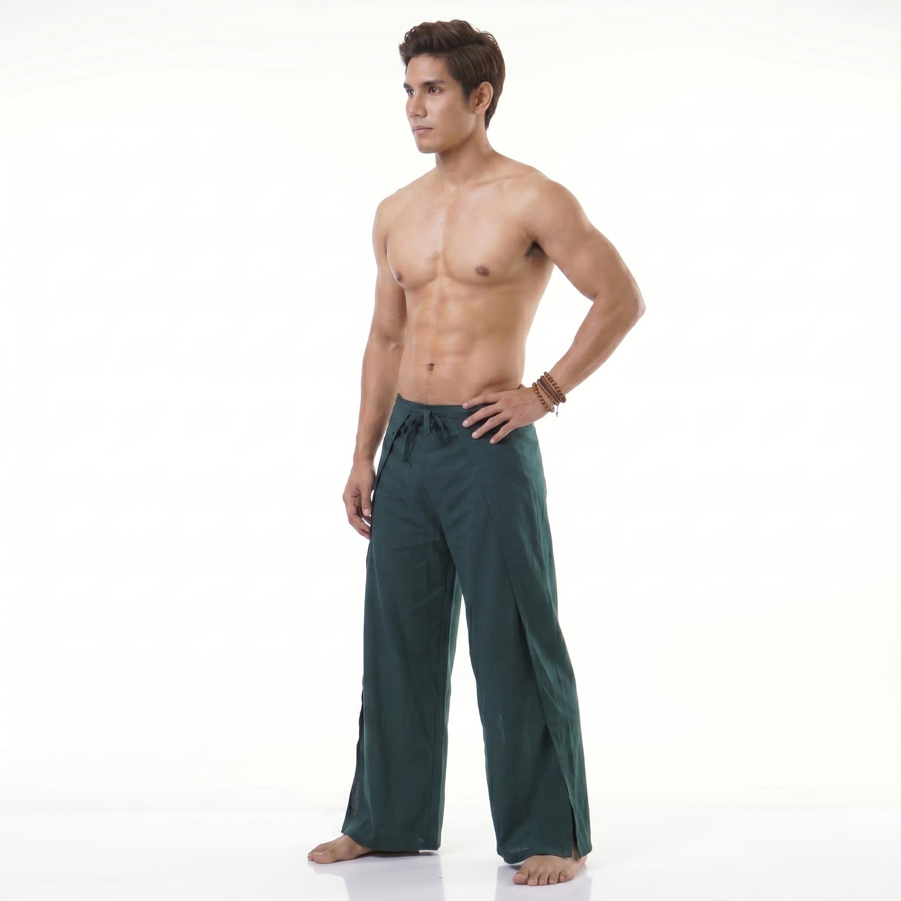 Side view of the turquoise wrap pants for men, emphasizing freedom of movement.