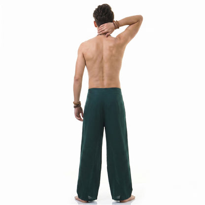 Back view of the turquoise Men's Thai wrap pants, highlighting the lightweight and flowing fabric.