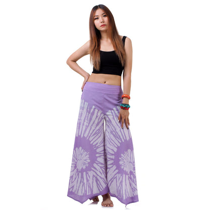 Side profile of the Vibrant Violet Hippie Tie Dye Palazzo Pants on a female model, showing the generous flare and graceful drape.