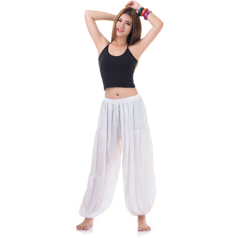 Female model wearing a white women Thai harem yoga pants with black shirt, front view