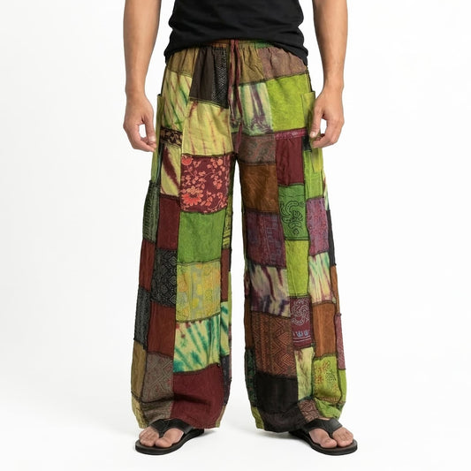 Close-up shot of olive patchwork men’s boho pants showing the earthy tones and detailed ethnic prints.