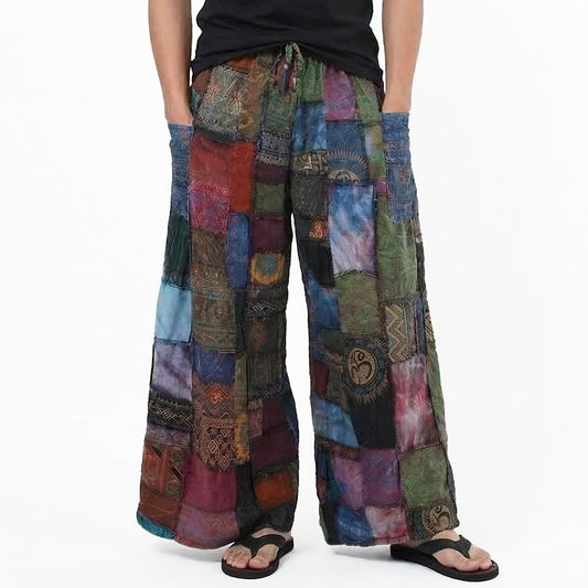 Close-up of purple patchwork men’s boho pants focusing on the vibrant spiritual symbols and patchwork seams.