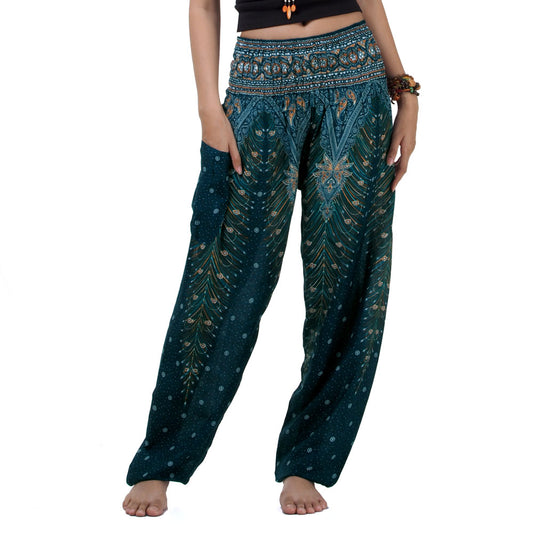 Close-up of turquoise Thai harem yoga pants with peacock print
