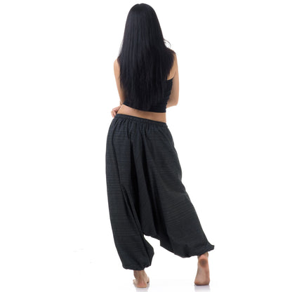 Back view of black women pinstripe drop crotch thai harem pants worn with black top