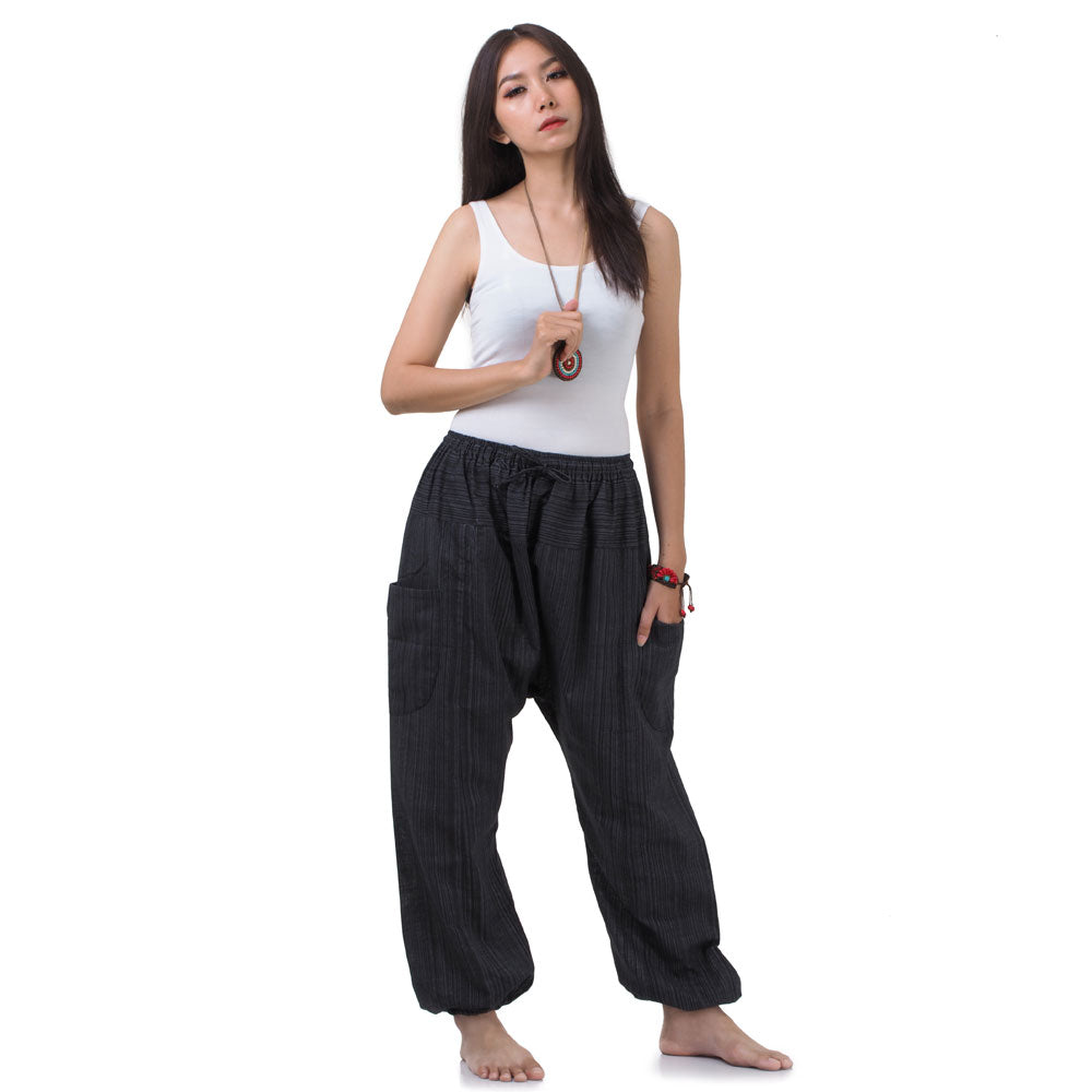 Side profile of the Black Sand pants, showing the flattering wrap-around style and elastic waist.
