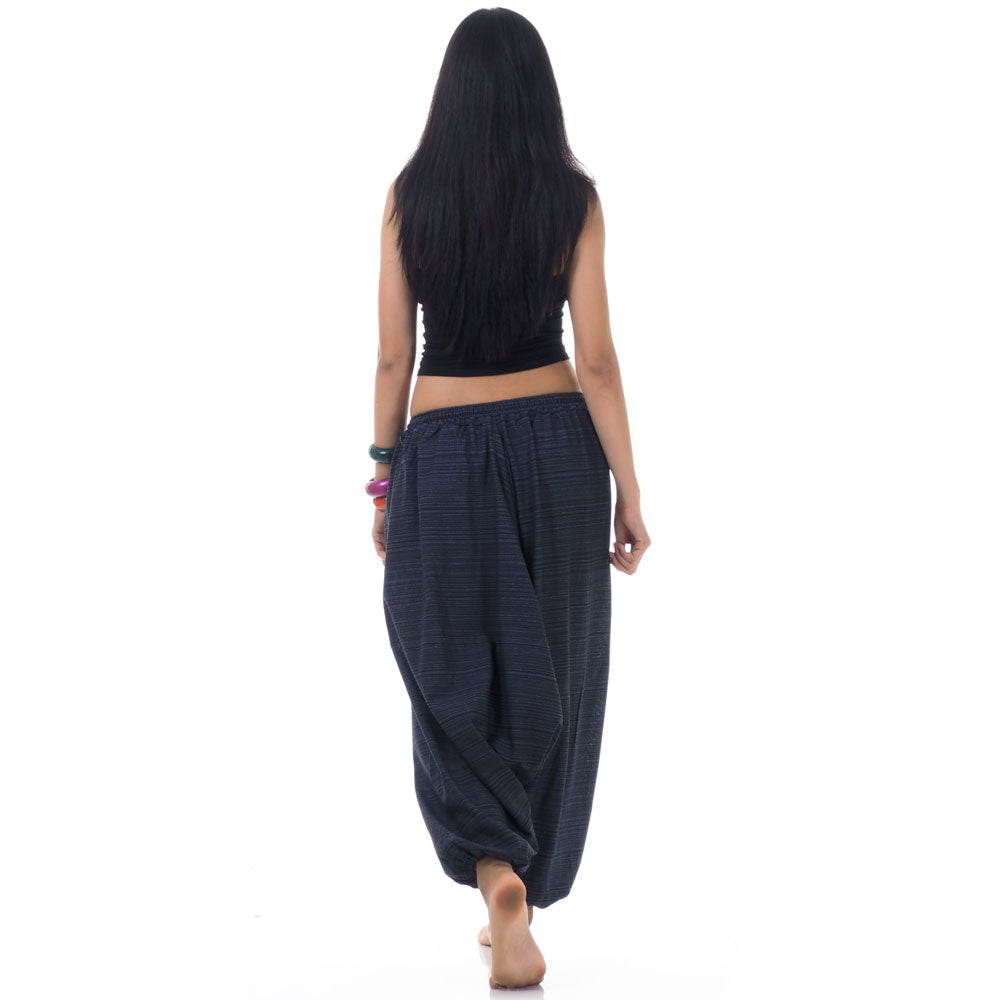 Back view of blue women pinstripe drop crotch thai harem pants worn with black top