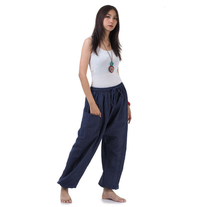 Side view of the Blue Lagoon pants, highlighting the flexible elastic ankles and waist.