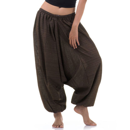 Close-up of a brown women pinstripe drop crotch thai harem pants