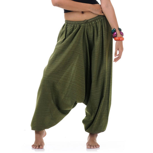 Close-up of a green women pinstripe drop crotch thai harem pants