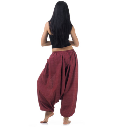 Back view of maroon women pinstripe drop crotch thai harem pants worn with black top