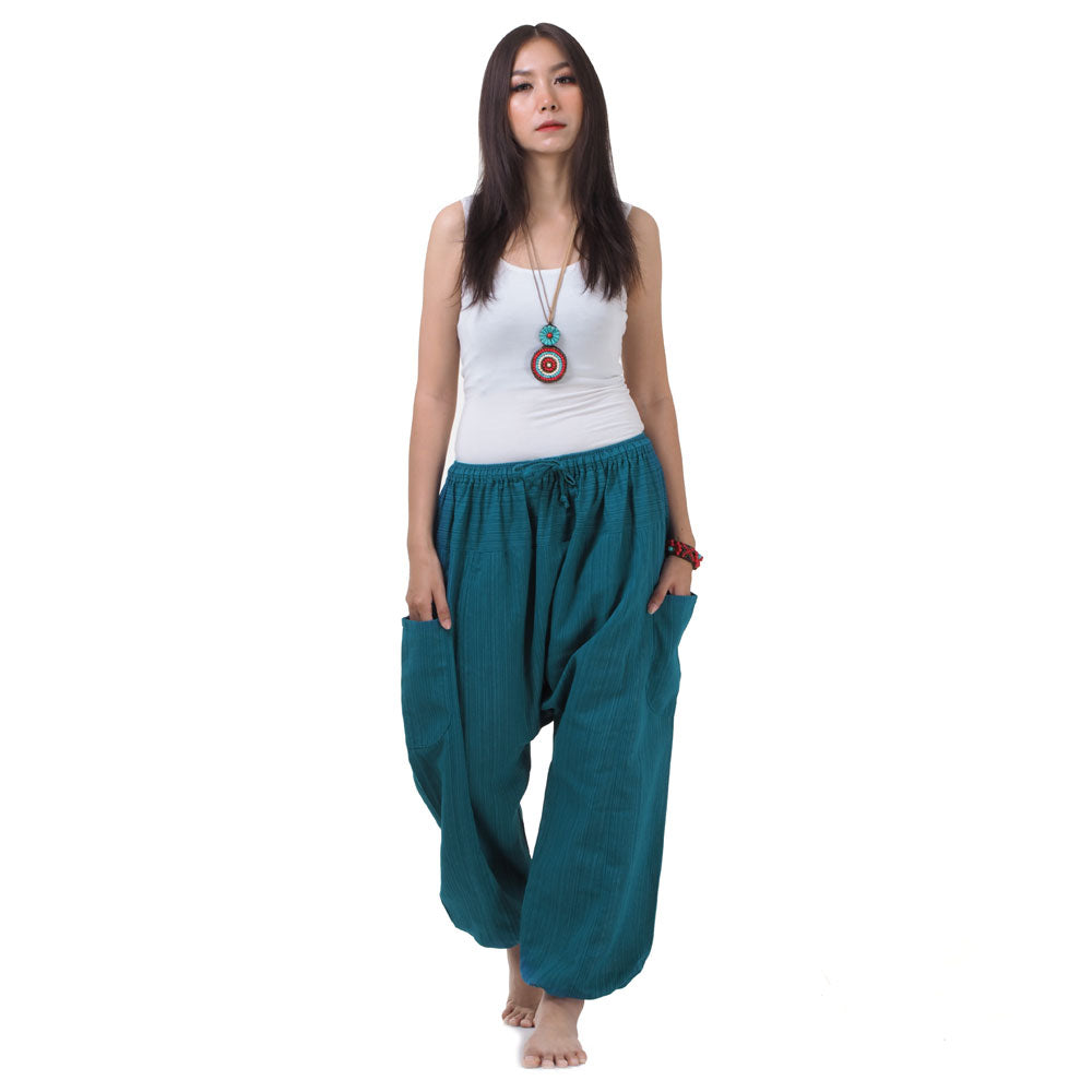 Front view of the Women's Pinstripe Harem Pants Turquoise Bay, featuring a comfortable elastic waistband and two convenient pockets.