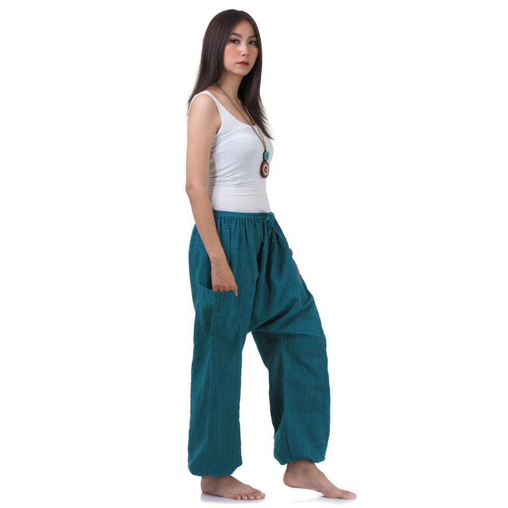 Side view of the Turquoise Bay pinstripe pants, showing the loose, comfortable fit and elastic ankle cuffs.