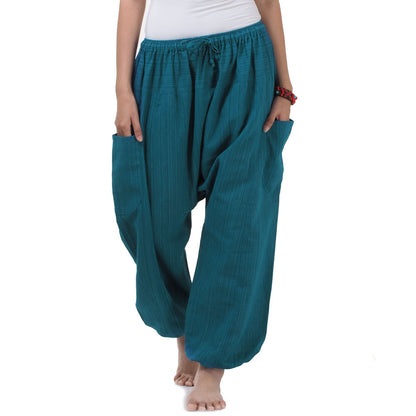 Close-up detail of the Turquoise Bay pinstripe harem pants, highlighting the 100% natural cotton fabric and subtle pinstripe pattern.