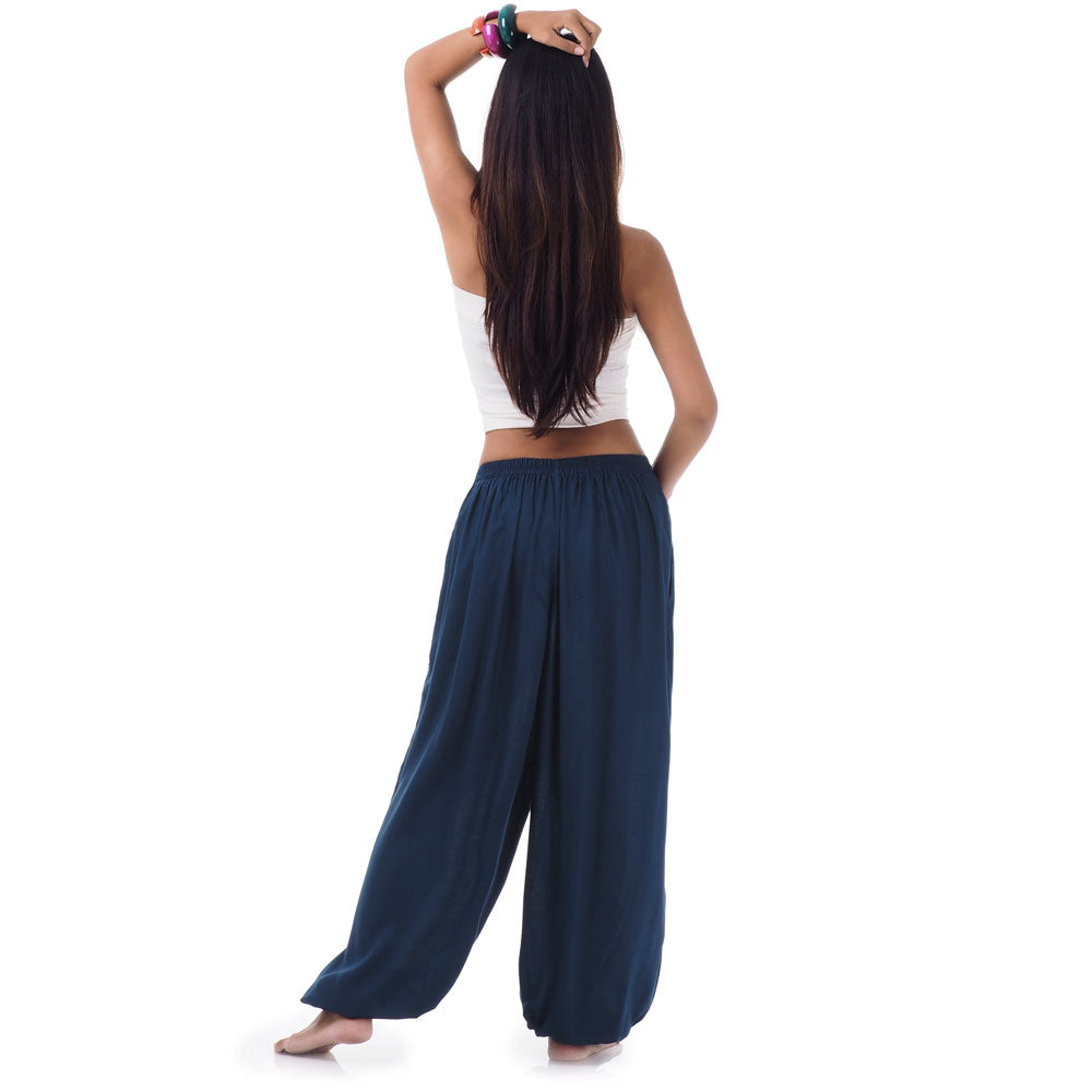 Back view of a female model wearing moonlight blue Thai pants, versatile fit Small-Medium.