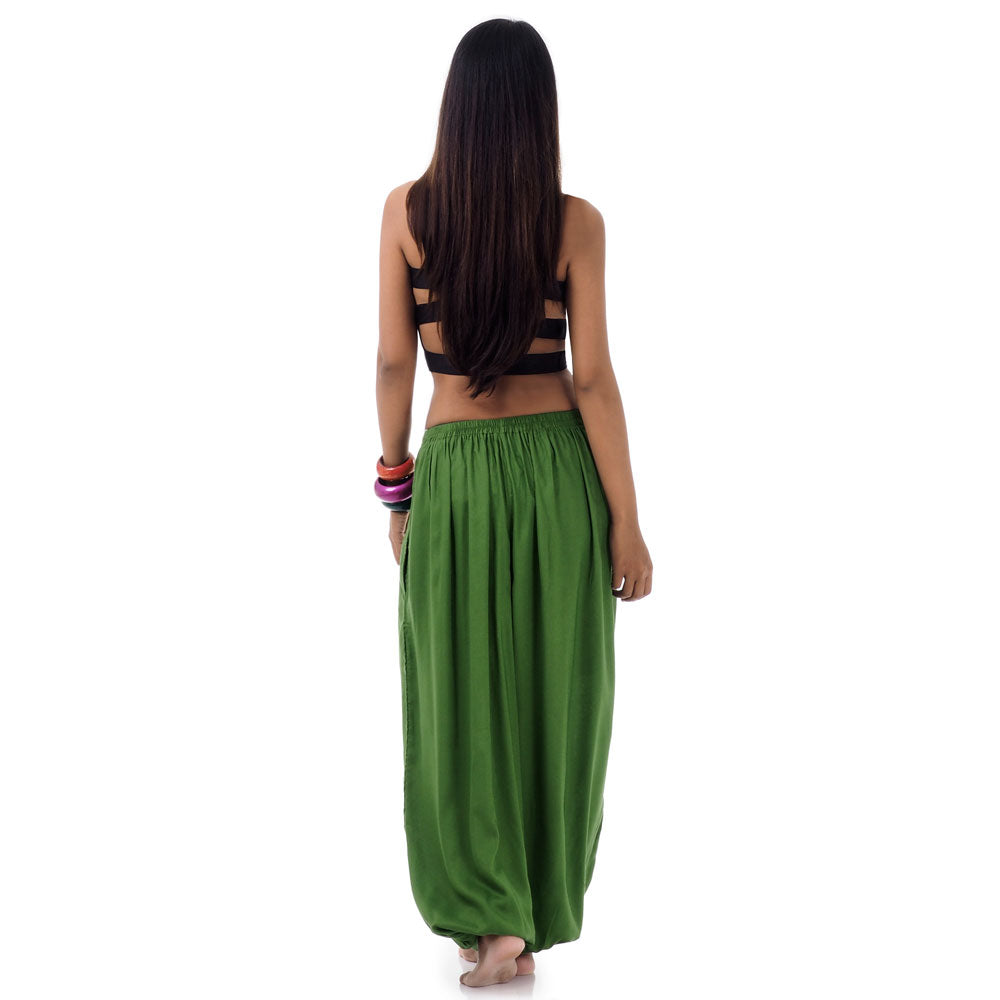 Back view of a female model wearing emerald oasis Thai pants, comfortable free-moving fit