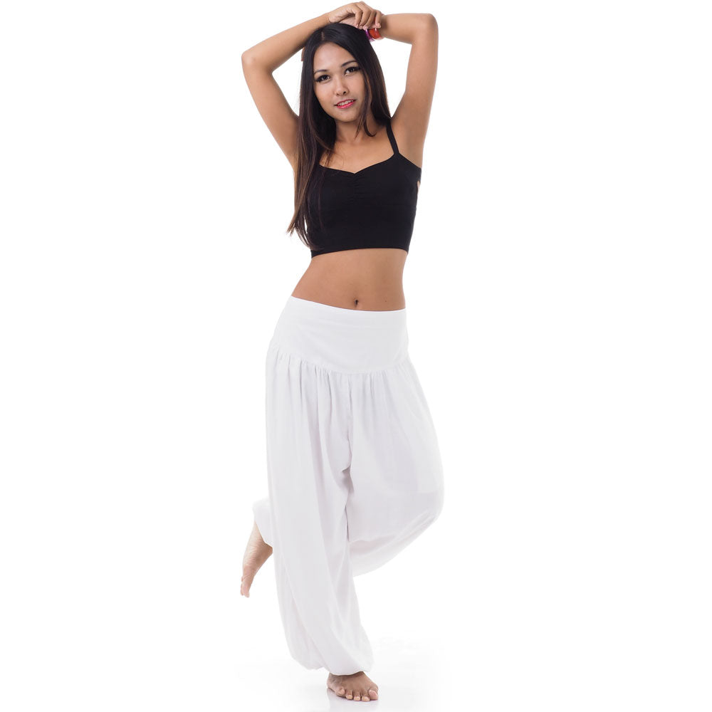 Front view of a female model wearing sunny white Thai harem pants, exotic sophistication fits S-M.
