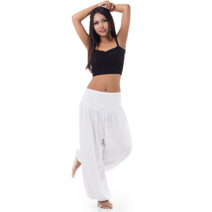 Front view of a female model wearing sunny white Thai harem pants, exotic sophistication fits S-M.