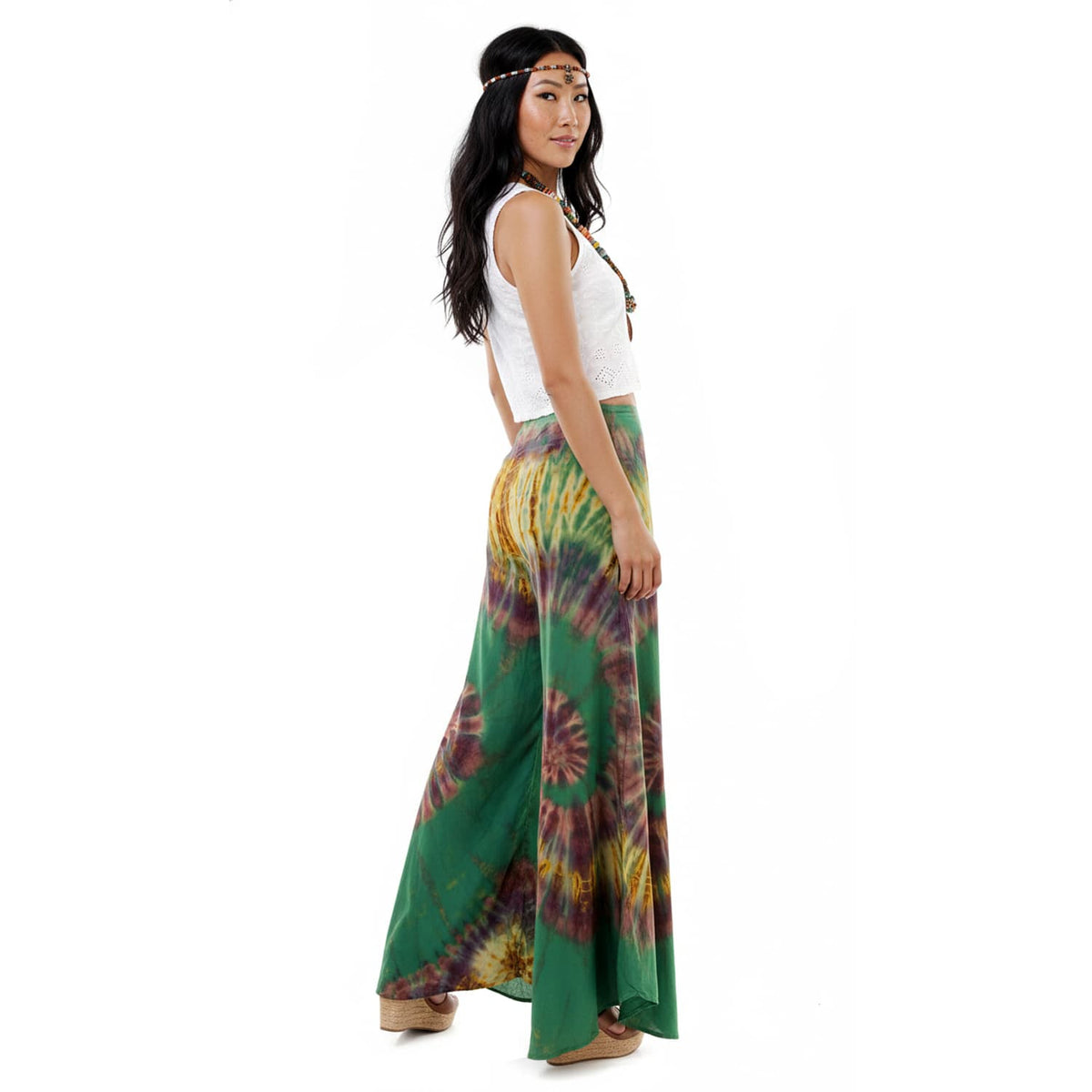 Side profile of the Emerald Oasis Hippie Tie Dye Palazzo Pants on a female model, displaying the airy and flowing design.
