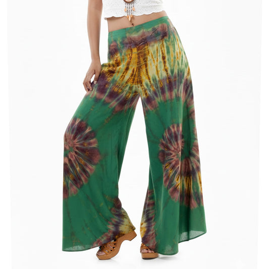 Close-up view of the Emerald Oasis Hippie Tie Dye Palazzo Pants fabric, highlighting the rich green handmade tie-dye pattern.
