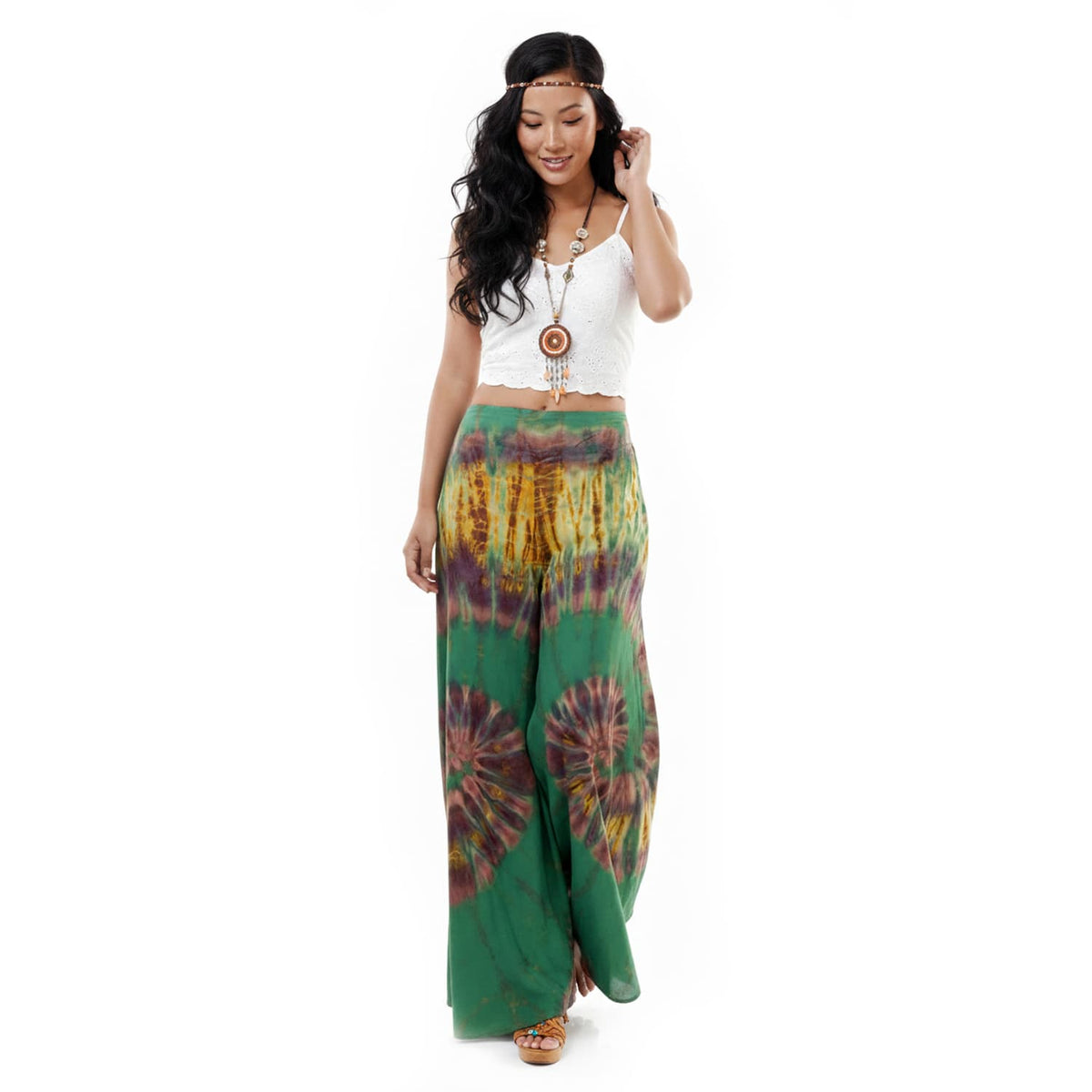 Front view of the Emerald Oasis Hippie Tie Dye Palazzo Pants on a female model, showcasing the wide palazzo leg and stretchy elastic waist.