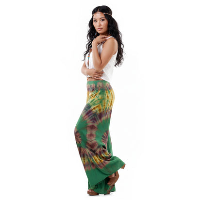 Side profile of the Emerald Oasis Hippie Tie Dye Palazzo Pants on a female model, displaying the airy and flowing design.