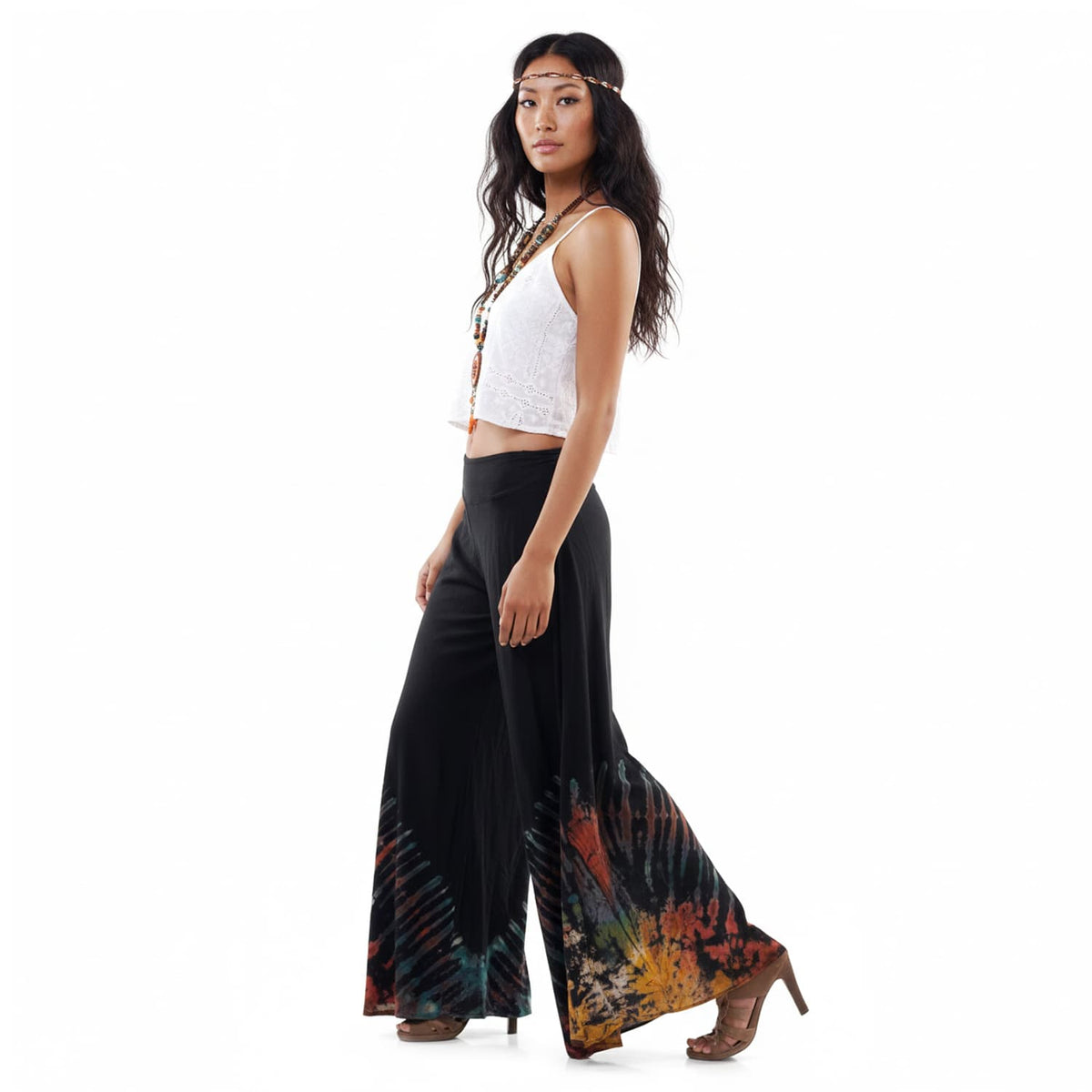 Side view of the Midnight Magic Hippie Tie Dye Palazzo Pants on a female model, illustrating the elegant flare and movement.