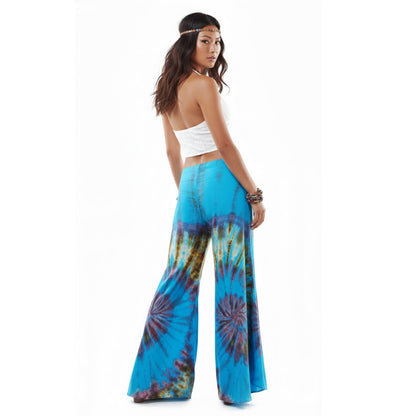 Rear view of the Ocean Blue Hippie Tie Dye Palazzo Pants on a female model, showing the relaxed fit across the hips and waist.