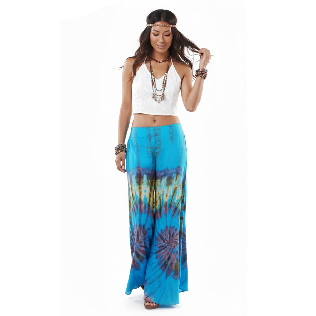 Front view of the Ocean Blue Hippie Tie Dye Palazzo Pants on a female model, presenting a chic and casual beach look.