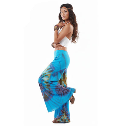 Side profile of the Ocean Blue Hippie Tie Dye Palazzo Pants on a female model, highlighting the wide flowing cut.