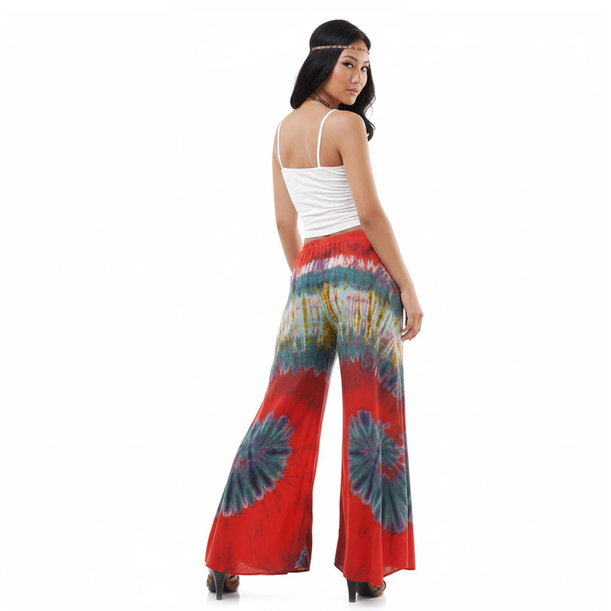 Rear view of the Crimson Sunset Hippie Tie Dye Palazzo Pants on a female model, showcasing the clean and comfortable rear cut.