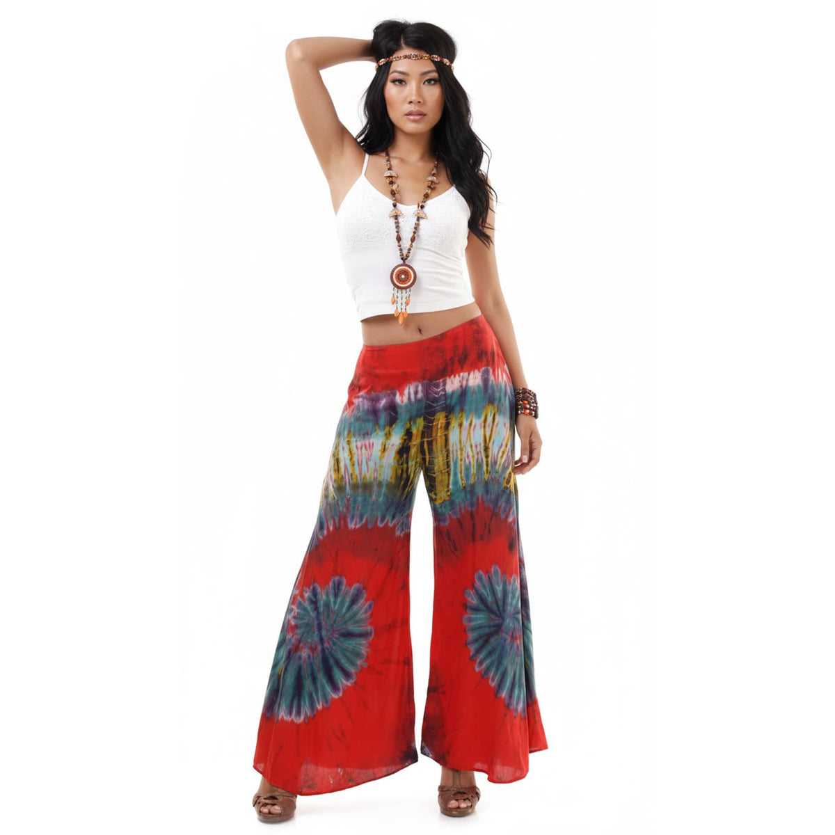 Front view of the Crimson Sunset Hippie Tie Dye Palazzo Pants on a female model, featuring the flexible waistband and wide legs.