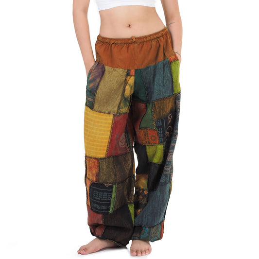 Close-up of orange Thai patchwork pants waistband showing handmade detail