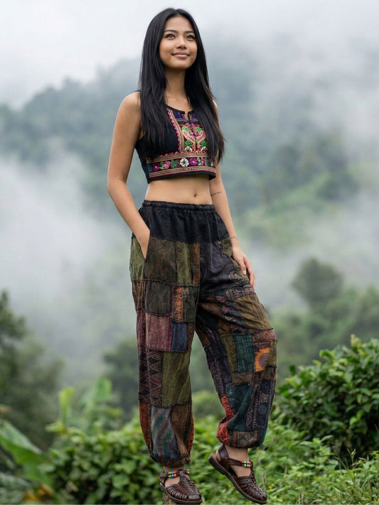 Woman wearing a patchwork my thai harem pants with a mountainous background