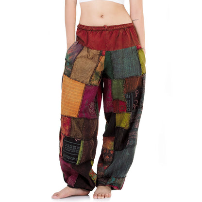 Close-up Multicolored Thai patchwork yoga harem pants on a white background