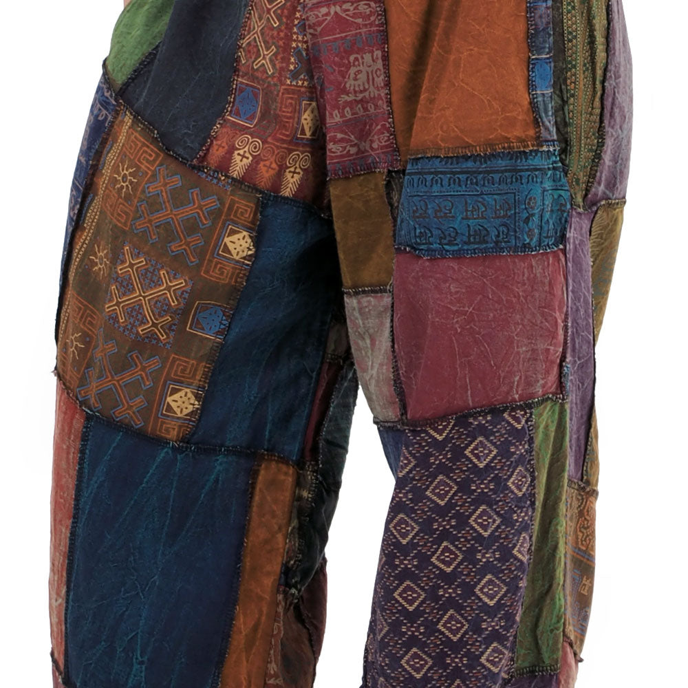 Multicolored patchwork coat with intricate patterns on a white background