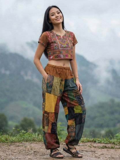 Woman wearing a patchwork my thai harem pants with mountains in the background