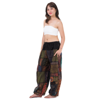 Side view showing loose dropped-crotch fit of brown Thai harem pants